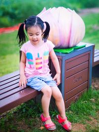 Girl sitting on grass