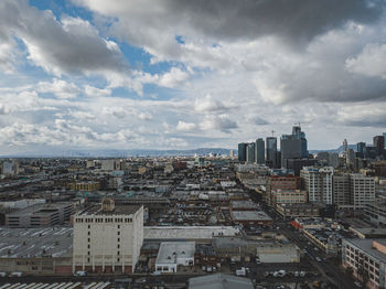 High angle view of buildings in city against sky