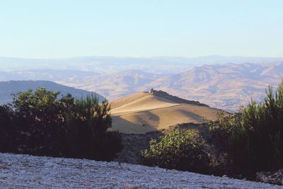 Scenic view of landscape and mountains against sky