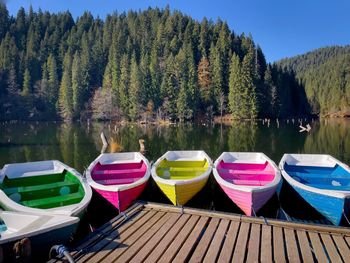 Boats moored in lake