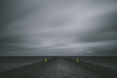 Scenic view of sea against storm clouds