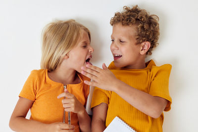 Cute sibling against white background