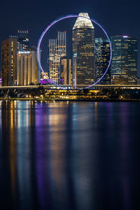 Illuminated buildings in city at night