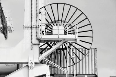 Low angle view of spiral staircase in building against sky