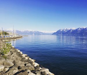 Scenic view of sea against clear blue sky