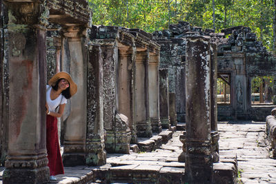 Full length of woman standing in temple