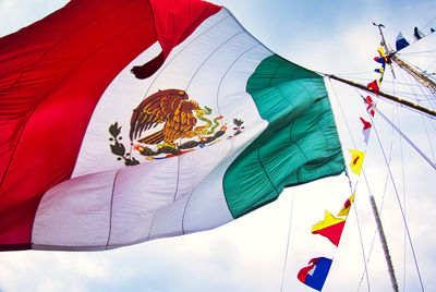 Low angle view of flag against sky