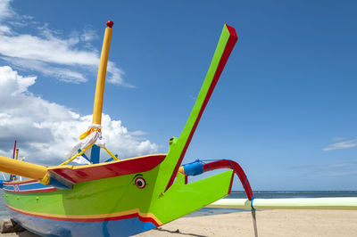 Scenic view of beach against clear blue sky