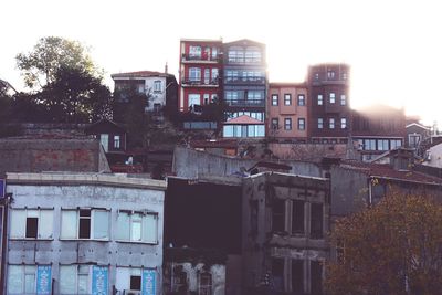 Exterior of houses in city against clear sky