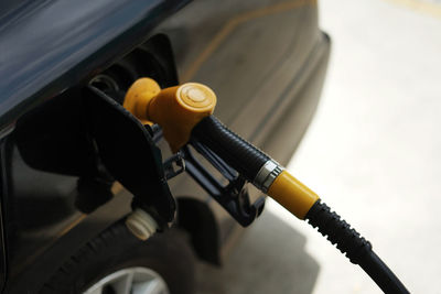 Refueling petrol into car gas tank.close up shot of petrol gun or nozzle fueling gas into car tank.