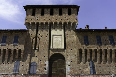 Low angle view of old building against clear sky