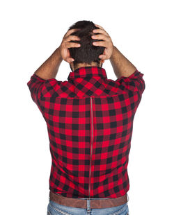 Rear view of man standing against white background