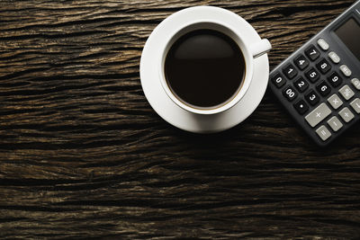 High angle view of coffee cup on table