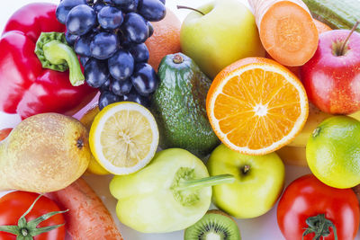 High angle view of various fruits and vegetables on white background