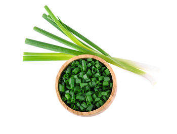 High angle view of green beans against white background