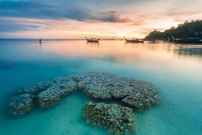 Scenic view of sea against sky at sunset