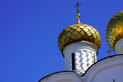 Low angle view of church against clear blue sky