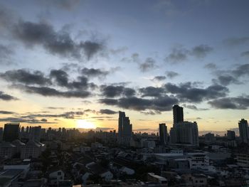 Cityscape against sky during sunset