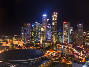 High angle view of illuminated buildings in city at night