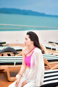 Young woman sitting on boat