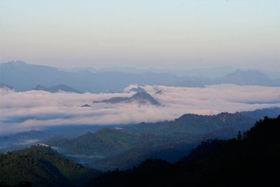 Scenic view of silhouette mountains against sky during sunset