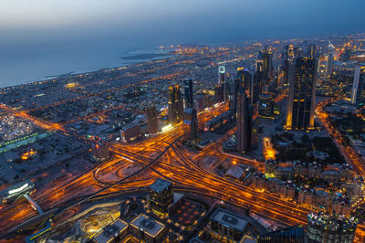 High angle view of illuminated cityscape at night