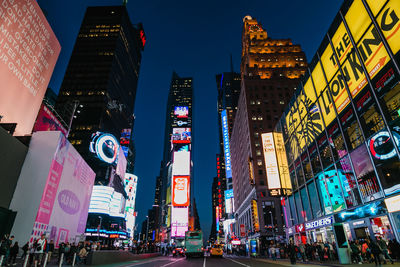 Low angle view of illuminated city at night