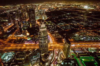 High angle view of illuminated buildings in city at night