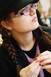 Close-up of thoughtful young woman looking away