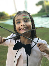 Portrait of a smiling woman holding water