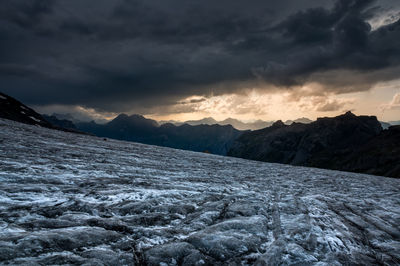 Scenic view of snowcapped mountains against sky during winter