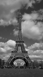 Silhouette of eiffel tower against cloudy sky