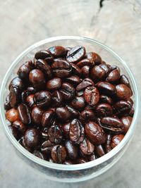 High angle view of coffee beans in bowl on table