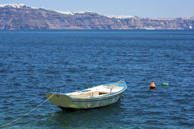 Nautical vessel on sea against sky