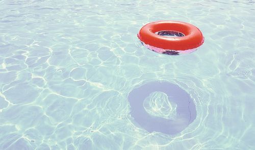 High angle view of ring floating on swimming pool