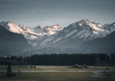 Scenic view of snowcapped mountains against sky