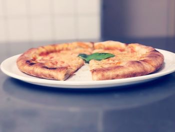 Close-up of pizza served in plate