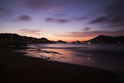 Scenic view of beach against sky during sunset