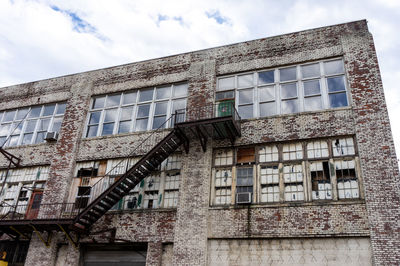 Low angle view of old building against sky