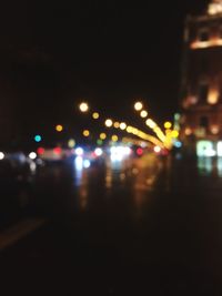 Defocused image of illuminated city at night