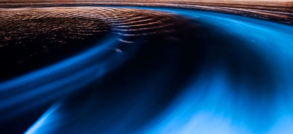 Close-up of illuminated car windshield at night