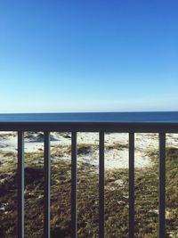 View of sea against clear blue sky