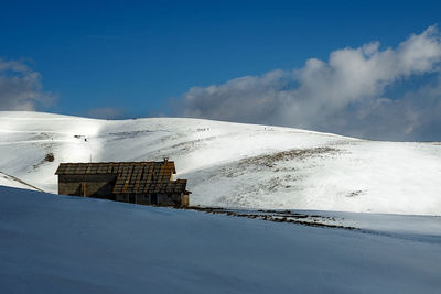 Snow covered mountain against sky