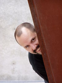 Portrait of man peeking