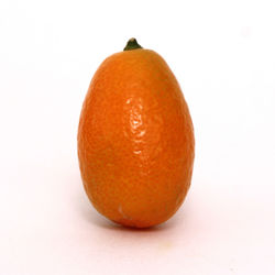 Close-up of orange apple against white background