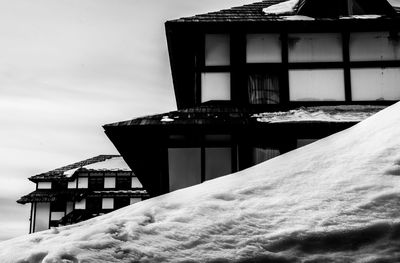 Low angle view of building against sky during winter