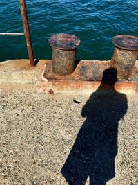 High angle view of couple shadow on shore