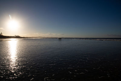 Scenic view of sea against clear sky during sunset