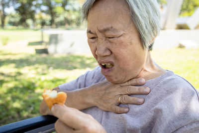 Portrait of mature man sitting outdoors