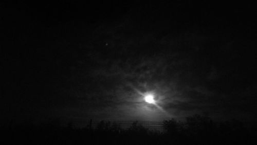 Low angle view of moon against sky at night